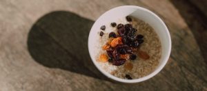 a bowl of cereals with dried fruits toppings